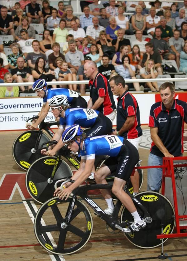 Victoria's under 19 team sprint team wait for the start of their final