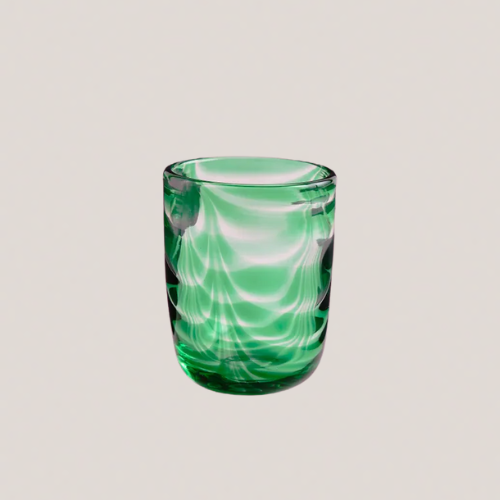 A tumbler with a green wavy pattern