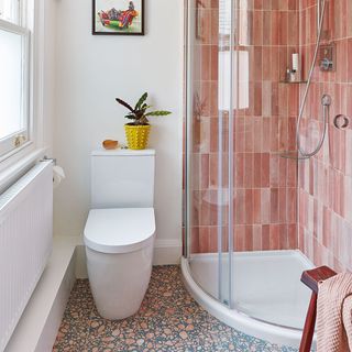 shower room with pink tiles