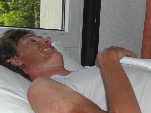 Grin and bear it: Van Summeren smiles but the massage is deep and painful