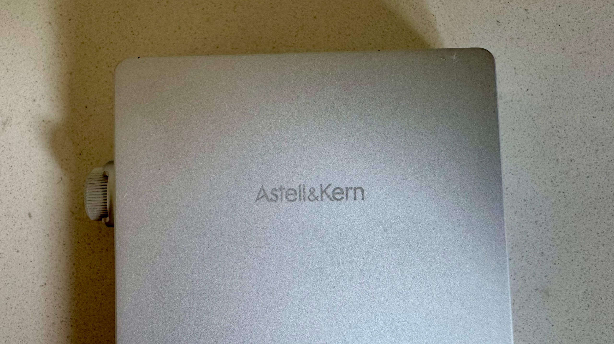 Astell &amp;amp; Kern's PD5 player on a gray table, showing details of the player