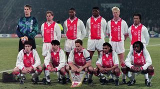AMSTERDAM, NETHERLANDS - MARCH 20: Ajax players line up for the team photos prior to the UEFA Champions League quarter final second leg match between Ajax and Borussia Dortmund at the Olympic Stadium Amsterdam on March 20, 1996 in Amsterdam, Netherlands. (Photo by Etsuo Hara/Getty Images)