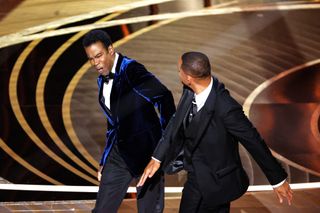 a photo showing Will Smith slap Chris Rock at the Oscars 2022