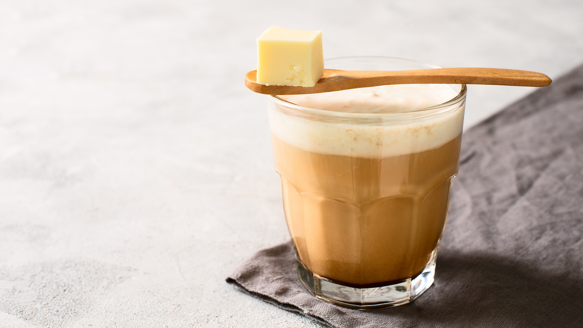 A glass of bulletproof coffee