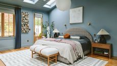 bedroom with blue walls and cozy decor