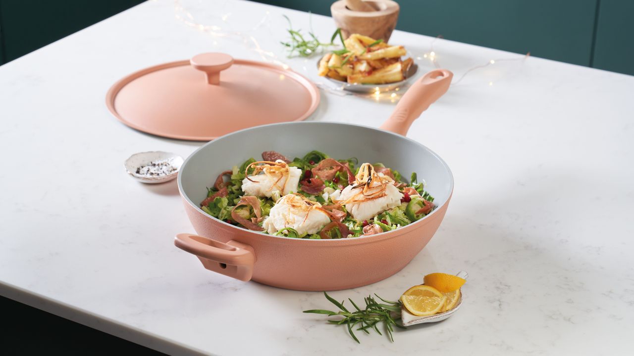 Dusty pink pan on top of counter displaying cooked food