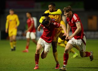 Josh Powell of Nottingham Forest and Ryan Jackson of Sutton United battle for the ball during the National League Cup match between Sutton United and Nottingham Forest U21 at VBS Community Stadium on February 04, 2025 in Sutton, England