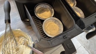 add batter to pans in air fryer for air fryer pancakes