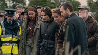 (L to R) Seán Óg Cairns as Garda Eoin, Kerri McLean as Maeve, Siobhán Cullen as Dove, Robyn Cara as Emmy Sizergh, Will Forte as Gilbert Power, looking at the car dredged from the bog in Bodkin episode 3