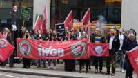 Protestors with an IWGB banner outside Take-Two's London office.