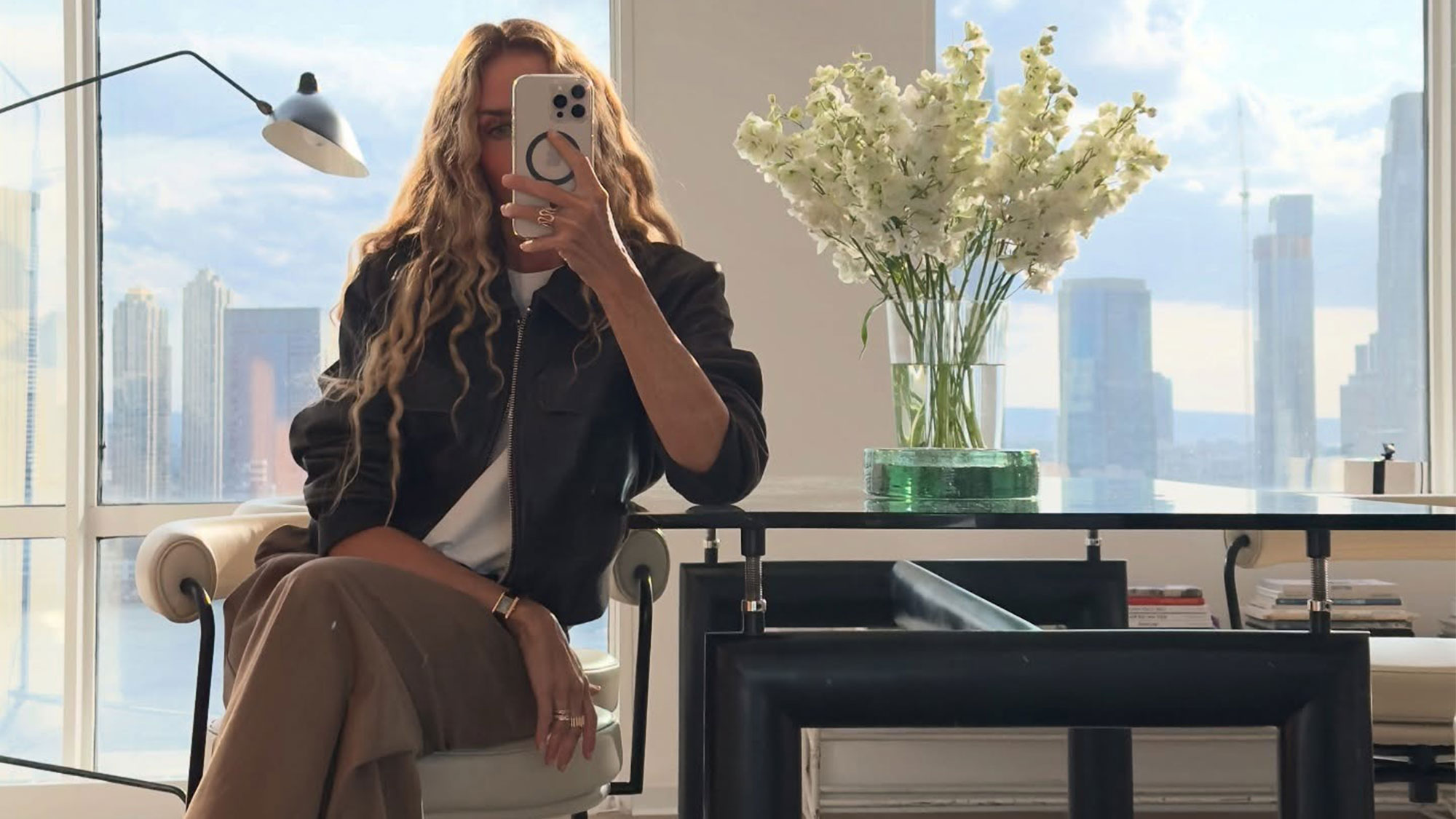 J.Crew's Olympia Gayot taking a selfie in her office.