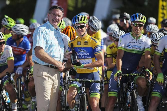Simon Clarke was presented with a nice bottle of bubbly at the start line