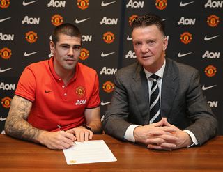 Victor Valdes of Manchester United poses with Manager Louis van Gaal after signing for the club at Aon Training Complex on January 8, 2015 in Manchester, England.