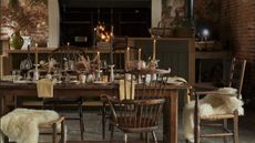 cozy dining room setting with candles and fur seat covers