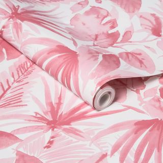 A square of peel and stick wallpaper in a pink, tropical print