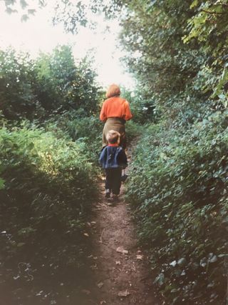 Guy Morgan walking through the woods with his botanist mother