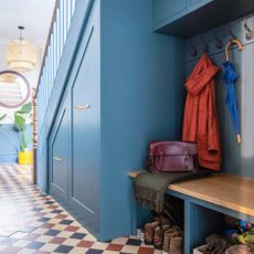 under-the-stairs ideas bootroom with hooks and cupbaords