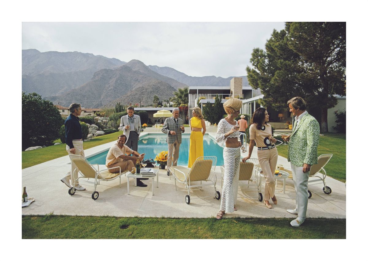 A poolside party at a desert house, designed by Richard Neutra for Edgar J. Kaufmann, in Palm Springs, January 1970. Featured in the group are: industrial designer Raymond Loewy, Nelda Linsk, wife of art dealer Joseph Linsk, and Helen Dzo Dzo