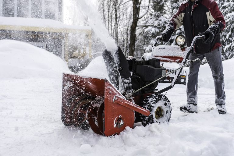 man using one of the best snow blowers