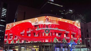 A massive, wrap-around display features immersive Christmas imagery.