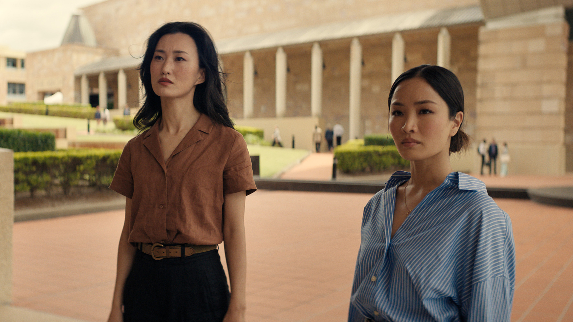 Keiko and Cate standing in a courtyard in Monarch: Legacy of Monsters season 2 episode 10
