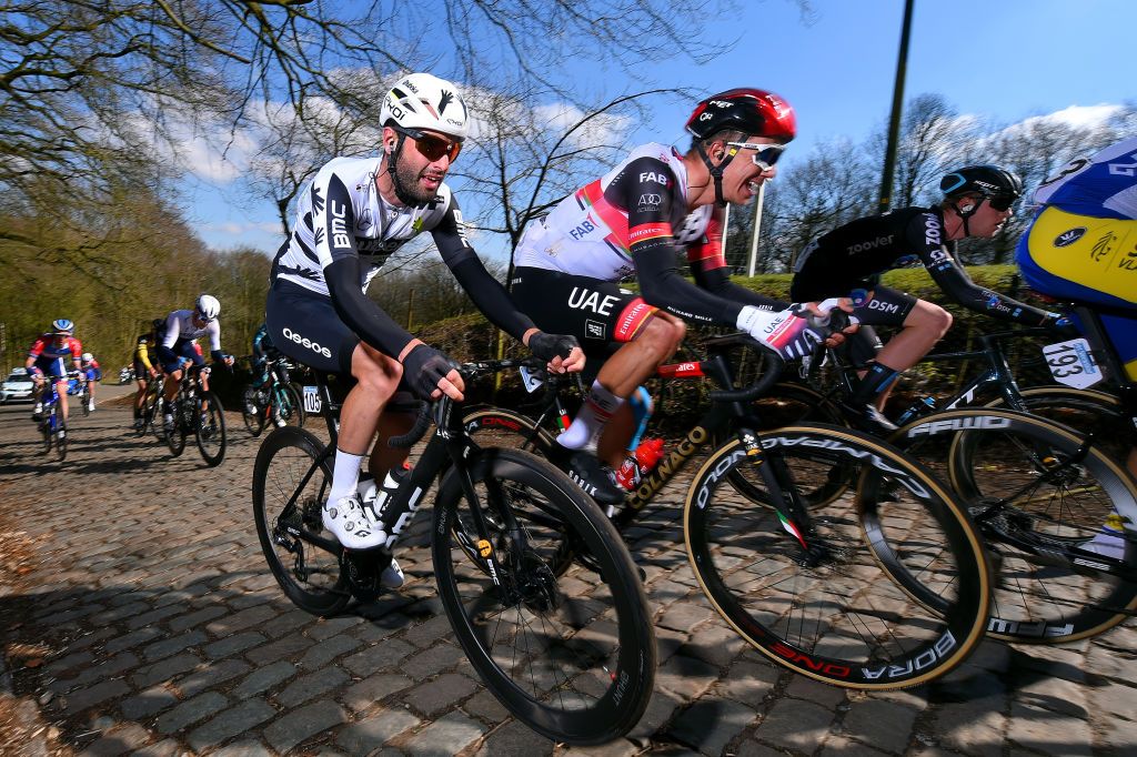 KOKSIJDE BELGIUM MARCH 19 Matteo Pelucchi of Italy and Team Qhubeka Assos Ivo Oliveira of Portugal and UAE Team Emirates Martin Salmon of Germany and Team DSM during the 19th Bredene Koksijde Classic 2021 a 199km race from Bredene to Koksijde Cobblestones Kemmelberg BredeneKoksijde on March 19 2021 in Koksijde Belgium Photo by Luc ClaessenGetty Images