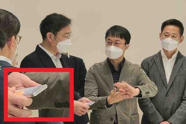 A Samsung executive holding a rollable phone