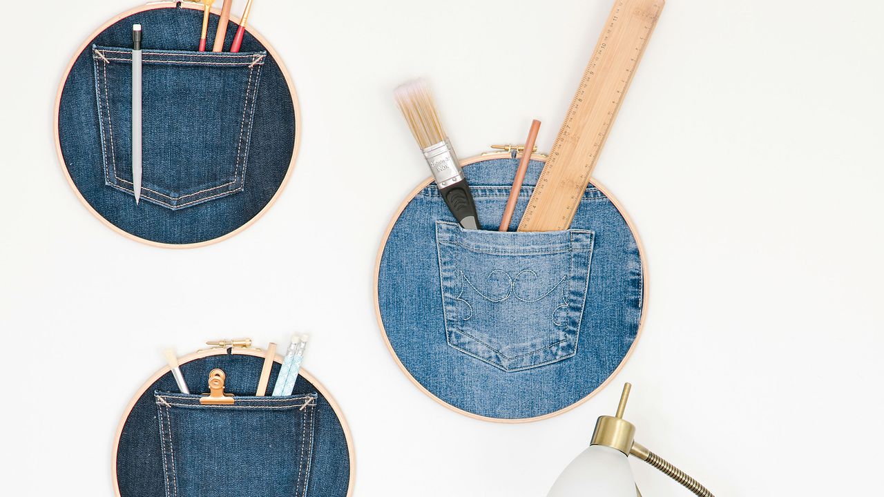 DIY jean embroidery hoops holding tools and pencils