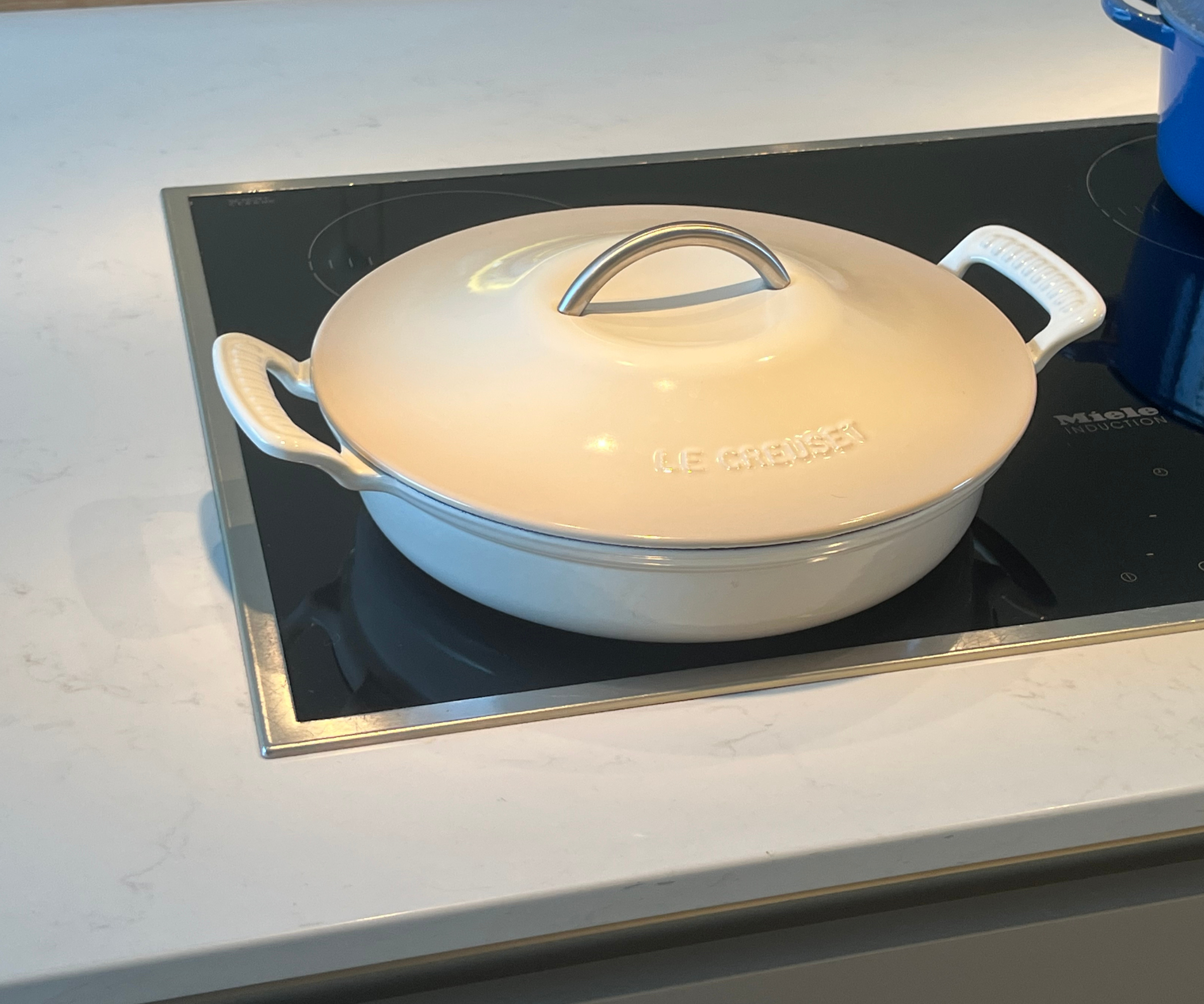 The Le Creuset Modern Heritage Round Braiser, fresh out the box on my induction stove