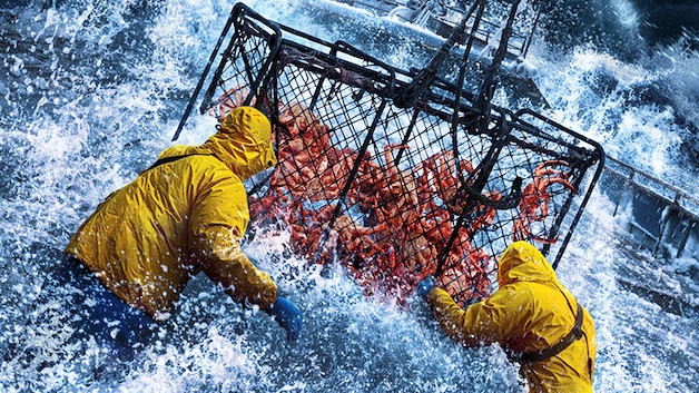 Fishermen grab a crab net in massive waves on deck in Deadliest Catch S22 on Discovery Channel