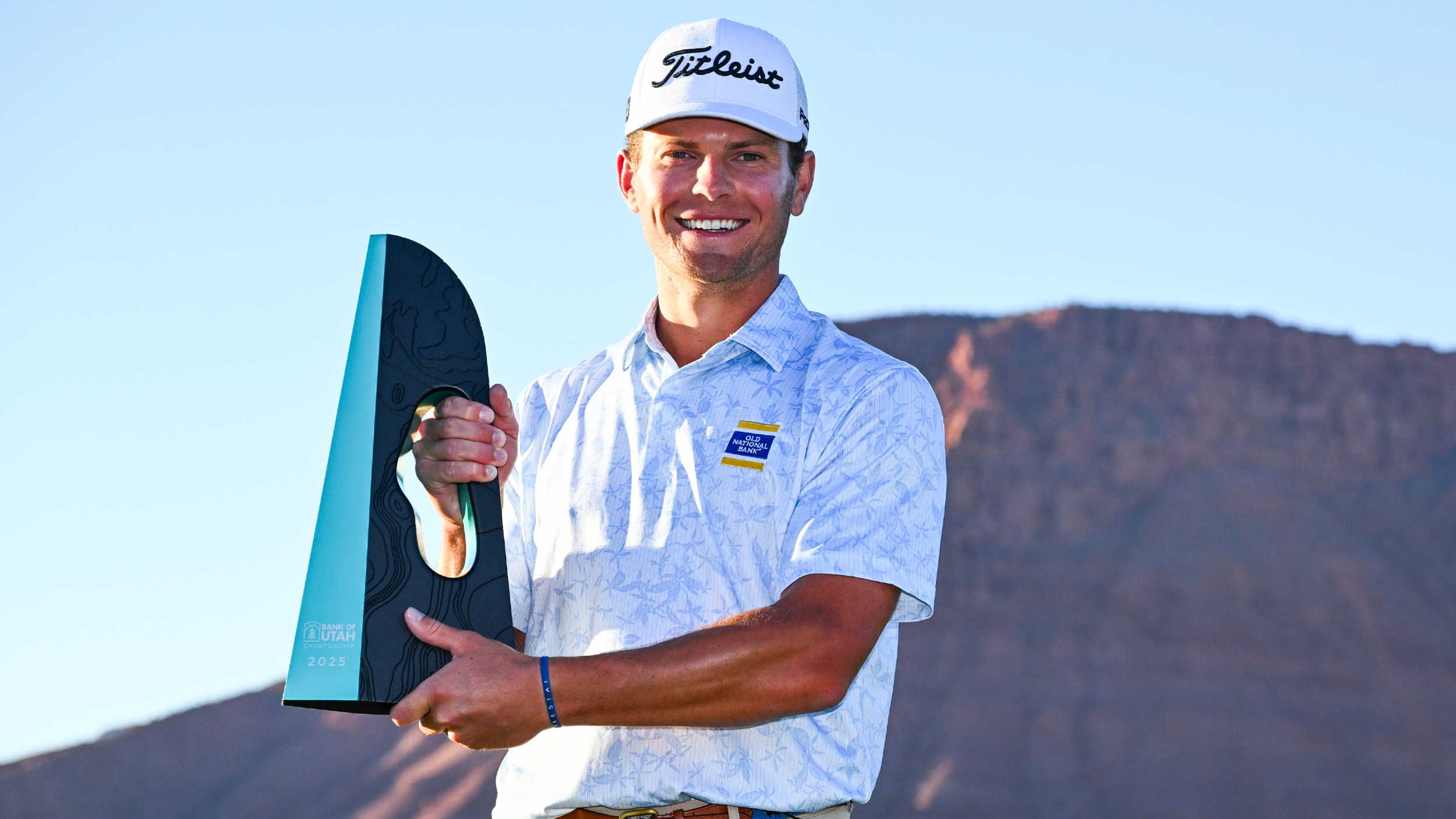 Michael Brennan with the Bank of Utah Championship trophy 