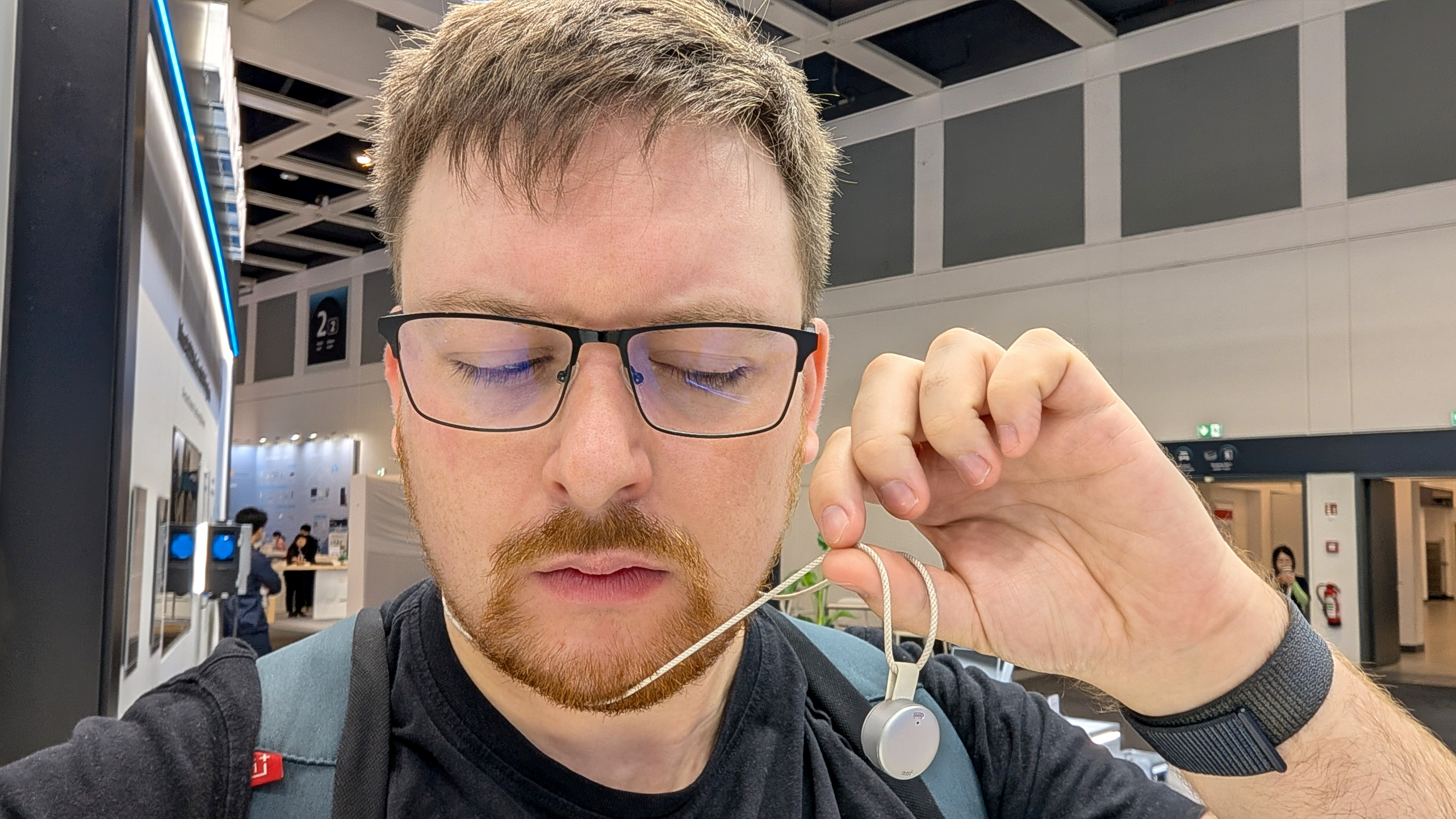 Soundcore Work held on lanyard