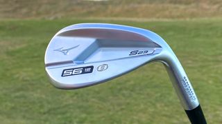The Mizuno S23 Wedge and its blade-design held aloft on the golf course