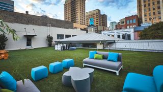 Design offices: Outdoor office area with a large chess set and grass