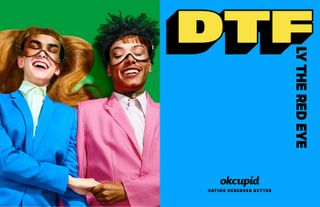 View of an OKCupid ad with a half green, half blue background. On the green side, there is a couple lying on their backs wearing blue and pink suits and holding hands. They are also wearing eye masks that have images of the other person's eye area on them. And on the blue side, there is text that says 'DTFly The Red Eye'