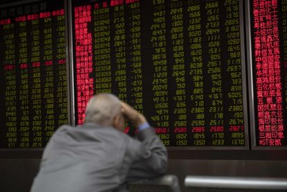 An investor looks at stocks in China