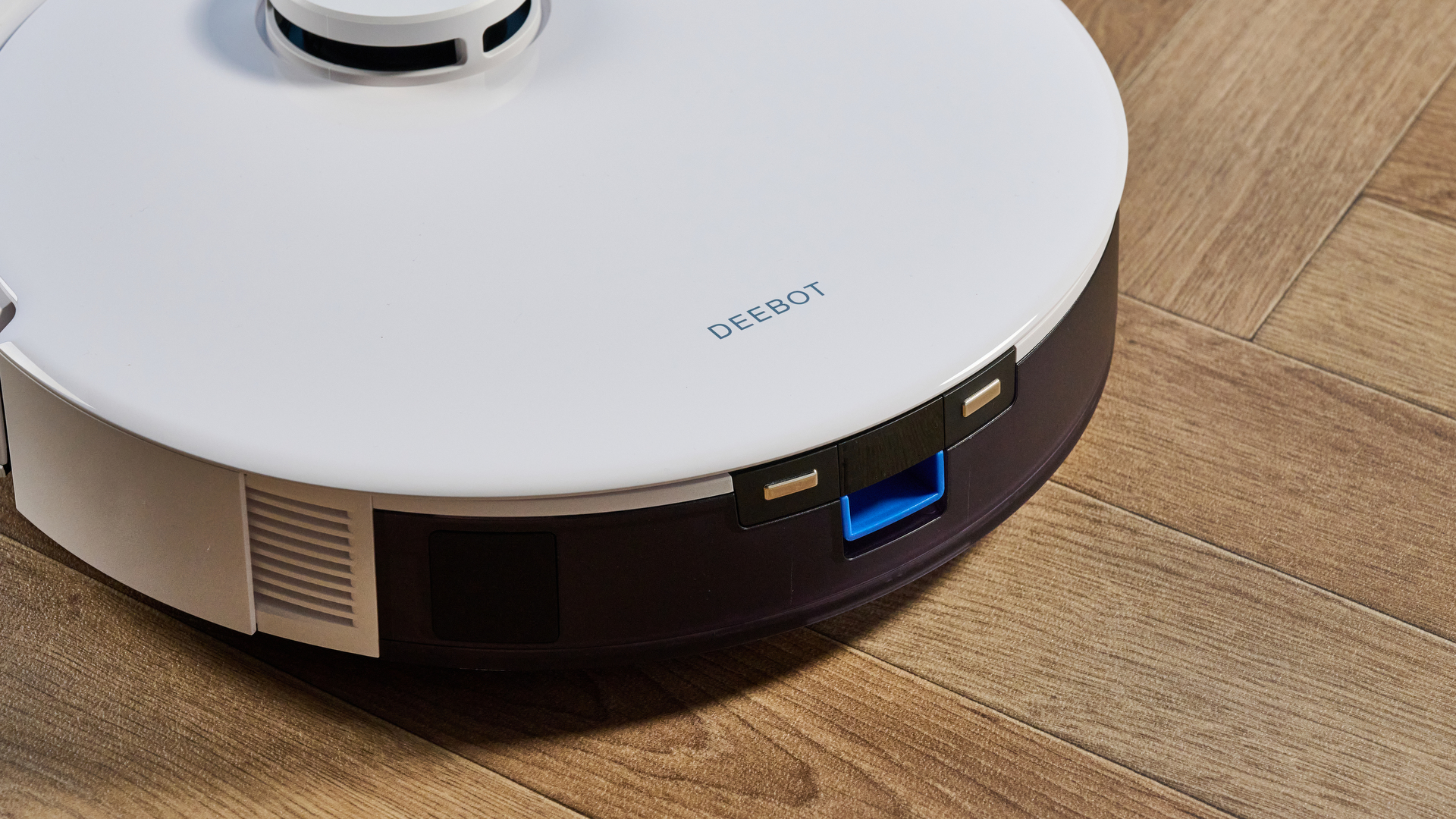 Ecovacs Deebot N20 in white photographed vacuuming floor