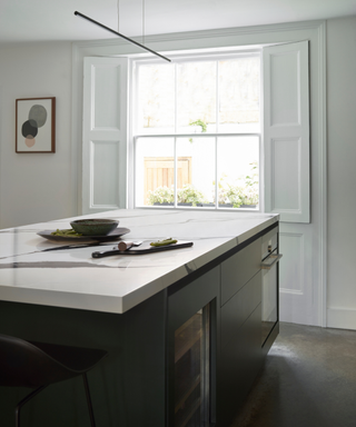 modern kitchen design with kitchen island and victorian style window