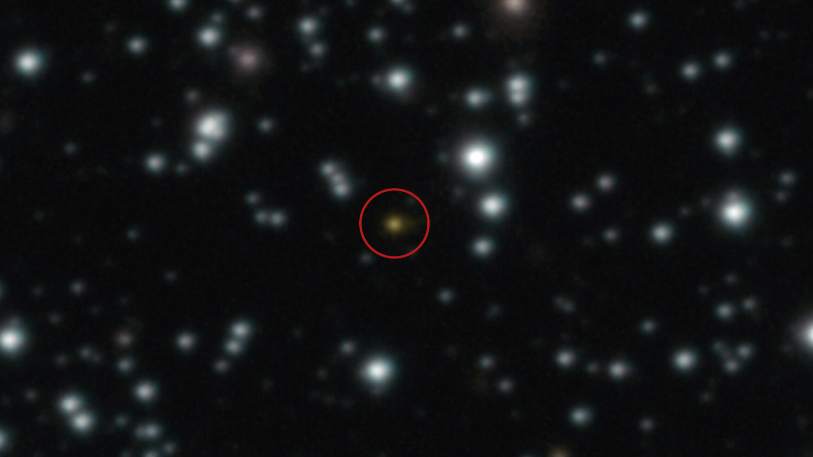 In this image captured by the VLT is an orange dot that is a powerful explosion that repeated several times over the course of a day, an event unlike anything ever witnessed before.
