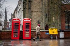 A man walks past a Covid-19 testing center in Southport, United Kingdom, on Feb. 2, 2021. 