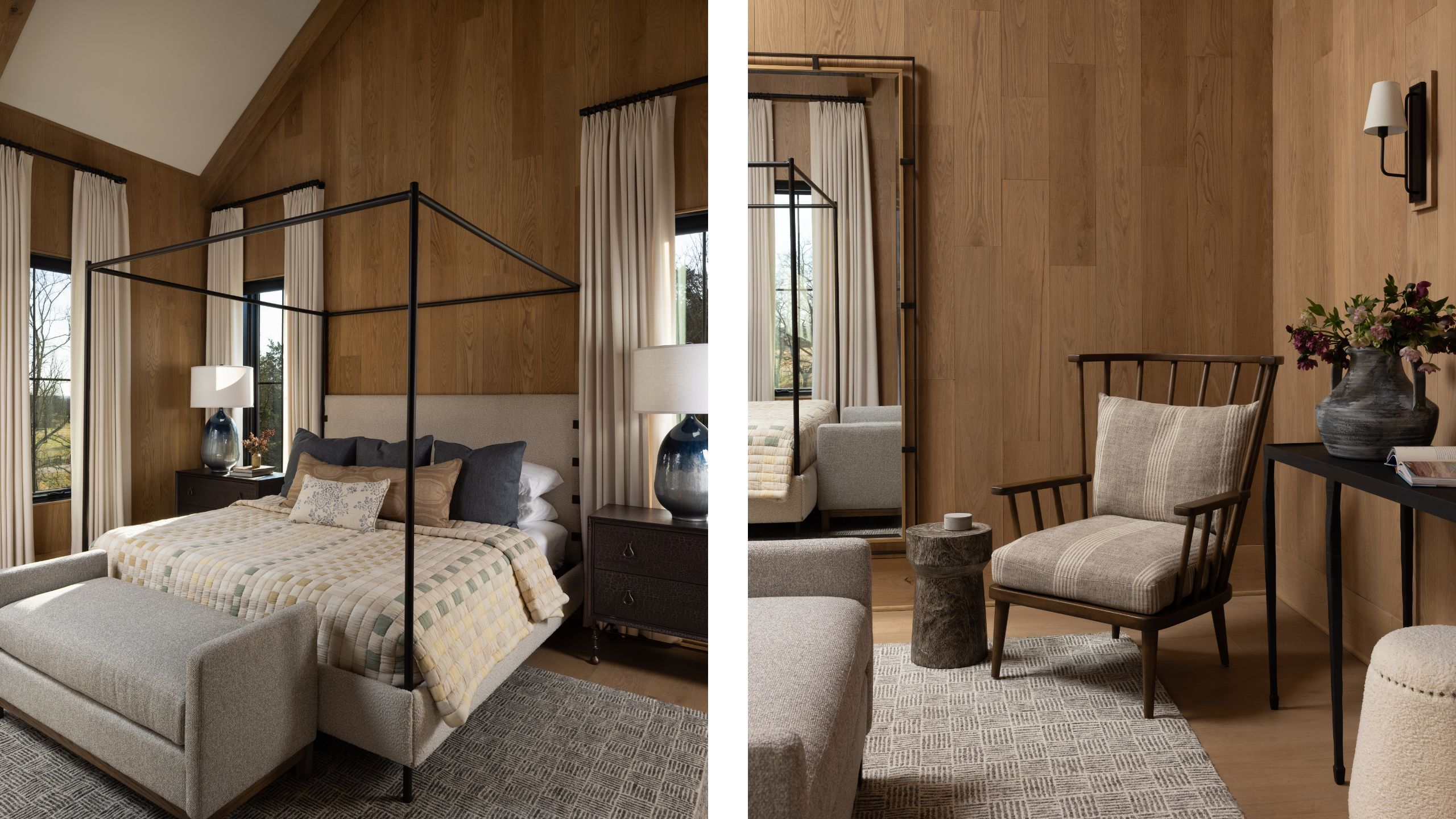 Side-by-side view of a bedroom with warm wood-paneled walls, featuring a black canopy bed on the left and a cozy seating nook with a wooden armchair and floor mirror on the right.