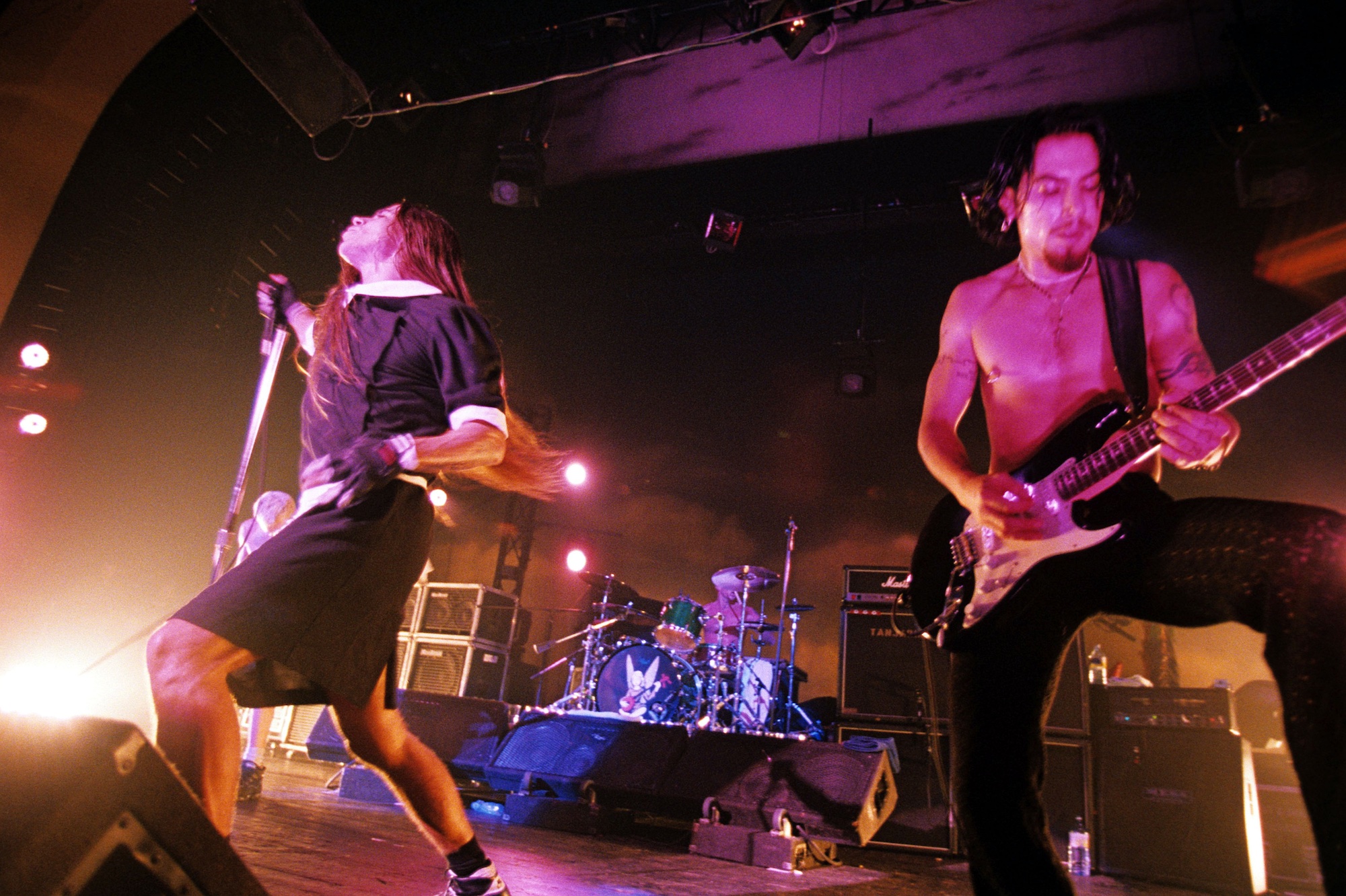 Anthony Kiedis (left) and Dave Navarro of the Red Hot Chili Peppers perform onstage at the Brixton Academy in London in October 1995