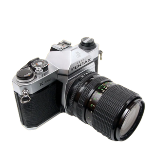 Pentax K1000 film camera on a white background