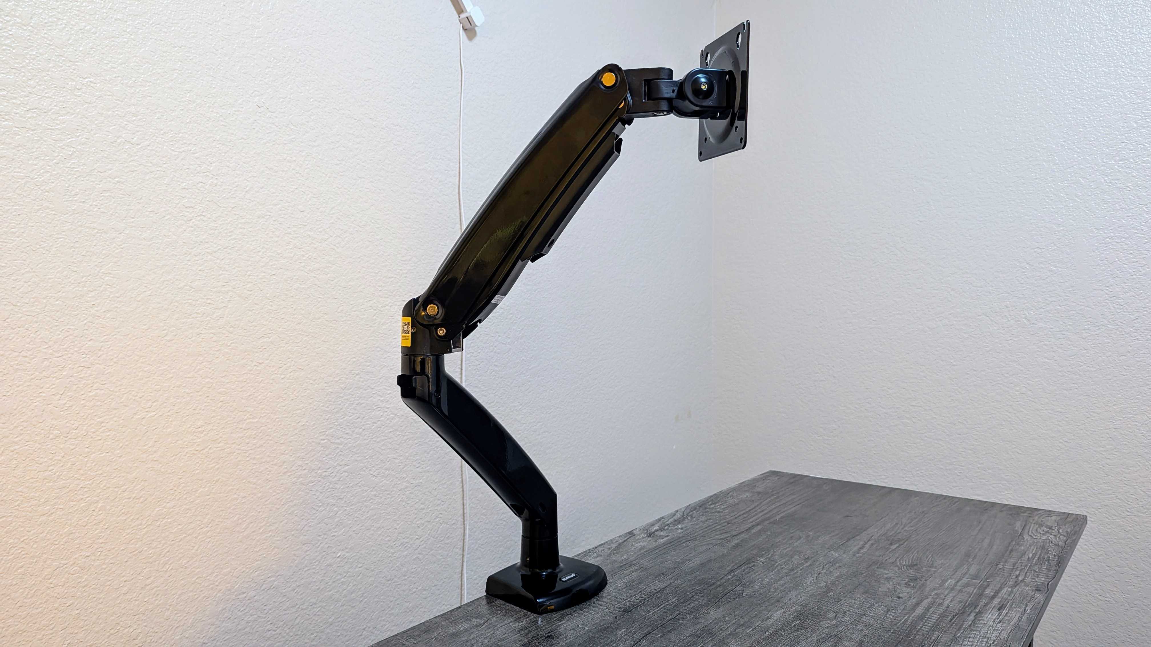 Solid and practical, I trust this monitor arm to support my $1,300 gaming monitor and free up desk space