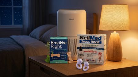 Anti-snoring products on a nightstand at night.