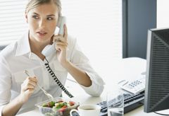 Woman eating lunch at desk