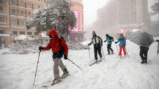 Skiiers in Madrid street