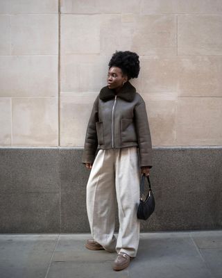 Danielle Jinadu wears a shearling coat for petites