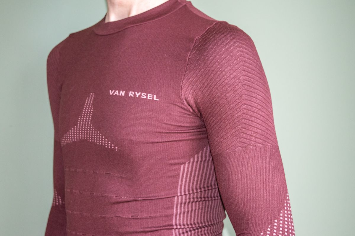 A man wearing the Van Rysel Long Sleeve Racer 2 base layer