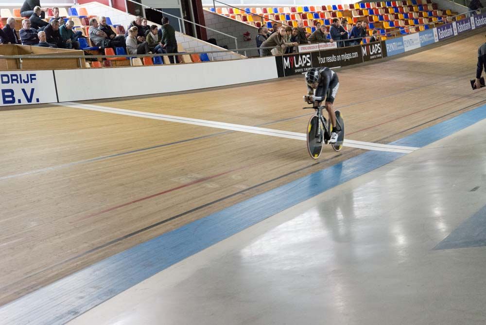 A small crowd watch Thomas Dekker on the track